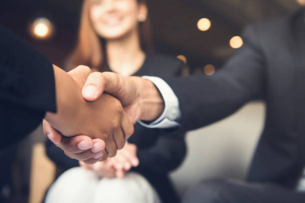 Auto Insurance Broker shaking hand with client